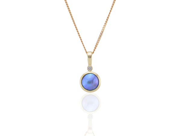 Gold necklace with a blue pearl and diamond
