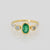 18ct yellow gold ladies dress ring with oval emerald and diamonds with white gold leaf shoulders.