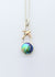 Sterling silver pendant with Eyris blue pearl and 9ct yellow gold swallow. Homeward bound