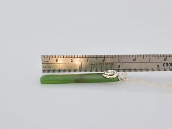 Size of Greenstone pendant with silver Koru motif