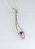 Sterling silver long open drop pendant with Amethyst set in rub over setting. 