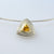 Triangle cut Citrine set in 9ct yellow gold in a sterling silver triangle pendant with texture