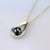 sterling silver upside down pearshape stylized pendant with Cook Islands black pearl