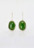 Sterling silver pounamu drop earrings with molten edges. The greenstone are domed and riveted onto the silver earrings