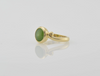 side view of gold greenstone ring