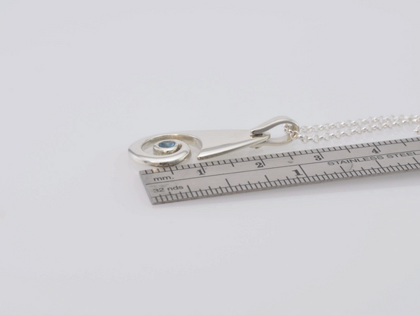 size of Koru drop pendant with Blue Topaz