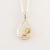 9ct yellow gold fantail in sterling silver pear shape frame  
