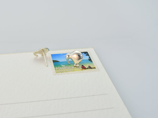 domed kiwi stud earrings on size sample