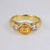 18ct yellow gold band ring with large oval Topaz and 2 diamonds on the side.