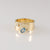 9ct yellow gold band ring with oval Blue Topaz and diamonds