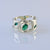 9ct white gold ring with oval and marquise emeralds
