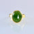 9ct yellow gold ring with oval greenstone/ Pounamu set on top of the band