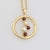 9ct yellow gold free form circle pendant with 2 white pearls and 3 cabochon ct garnets