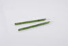 Green earrings on a white background