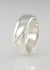 Sterling silver band ring. Curved with diagonal groove