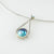 drop shape silver wire with Eyris blue pearl in rub over setting and 9ct yellow old seting with blue topaz on omega chain