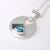 sterling silver pendant with triable free form shape Blue Topaz set in 9ct yellow gold
