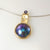 9ct yellow gold pendant with Eyris blue pearl, diamonds and Tanzanite.