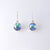 sterling silver drop earrings with rub over settings and Eyris blue pearls