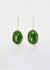 Sterling silver pounamu drop earrings with molten edges. The greenstone are domed and riveted onto the silver earring. s