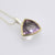 Triangle Ametrine/ Amethyst triangle pendant set in a sterling silver rubover pendant with 9ct yellow gold setting