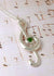 Sterling silver treble clef pendant with greenstone/ Pounamu cabochon set in the center
