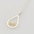 9ct yellow gold dragonfly in sterling silver pear shape frame