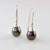 Sterling silver drop earrings with pearl cap and cook islands black pearls