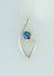Sterling silver pendant with koru design and Eyris blue pearl pendant