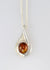 Sterling silver teardrop shape pendant with natural Amber oval cabochon