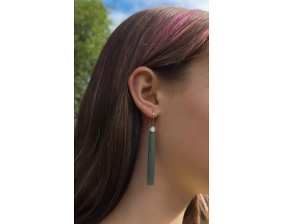 greenstone circle drop earrings on model
